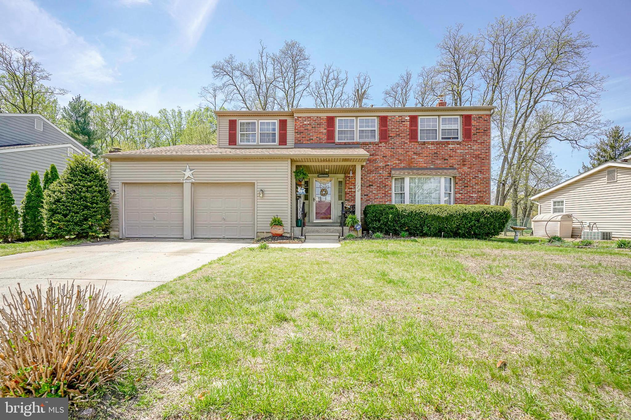 118 Golfview Drive Sewell, NJ 08080 - Photo 3 of 39 a front view of a house with a yard and garage