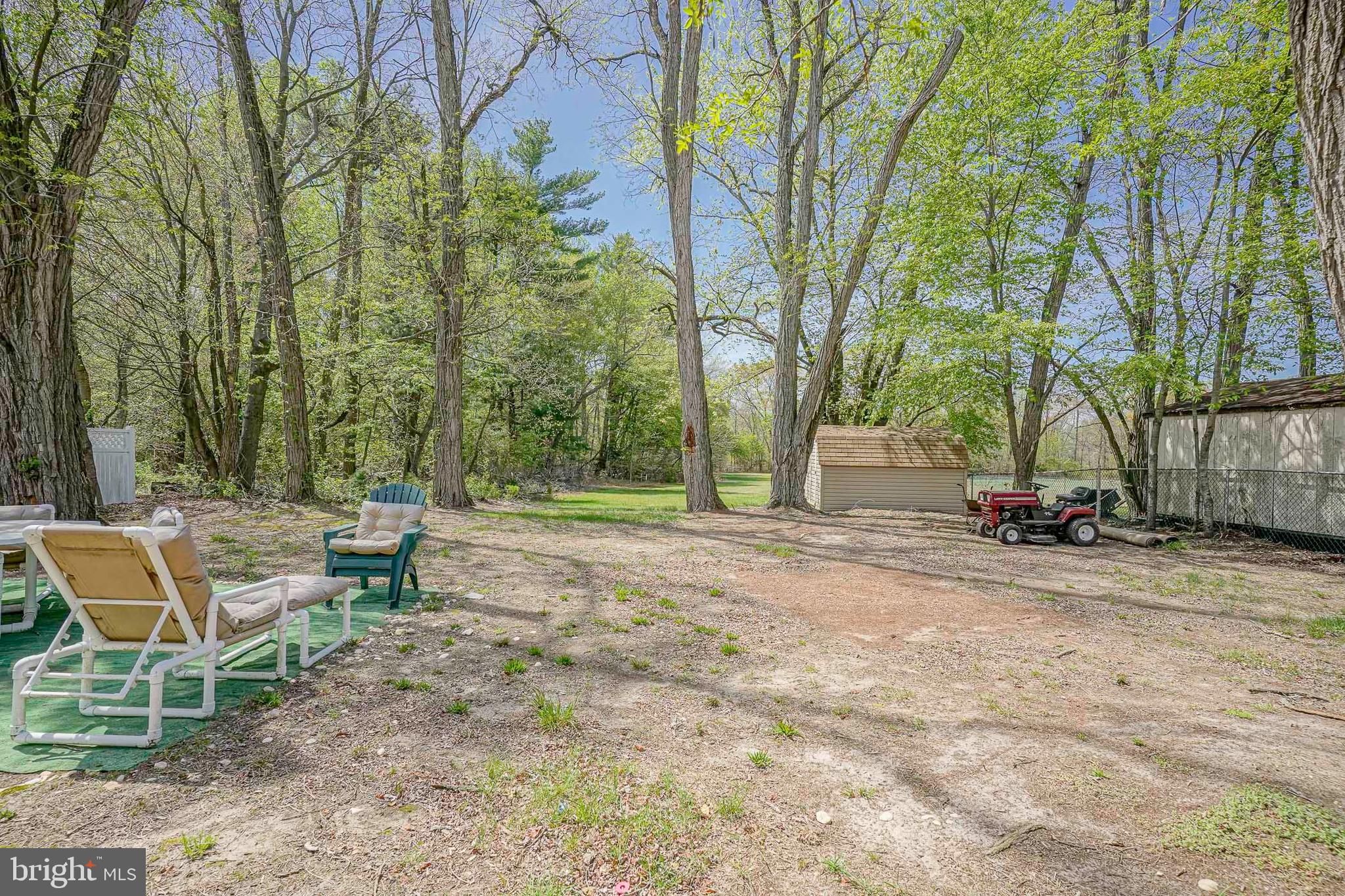 118 Golfview Drive Sewell, NJ 08080 - Photo 36 of 39 a view of backyard with table and chairs and a large tree
