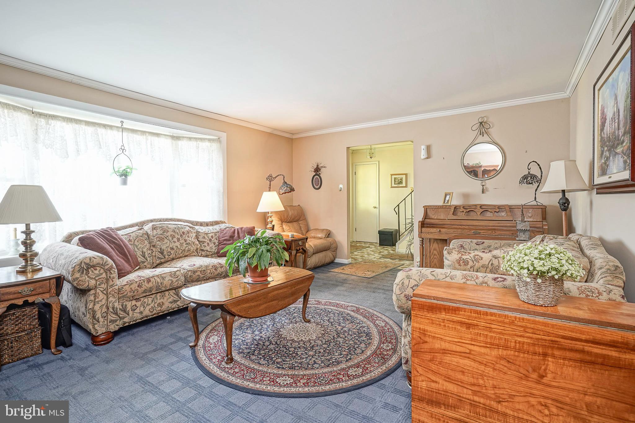 118 Golfview Drive Sewell, NJ 08080 - Photo 6 of 39 a living room with furniture potted plant and a large window