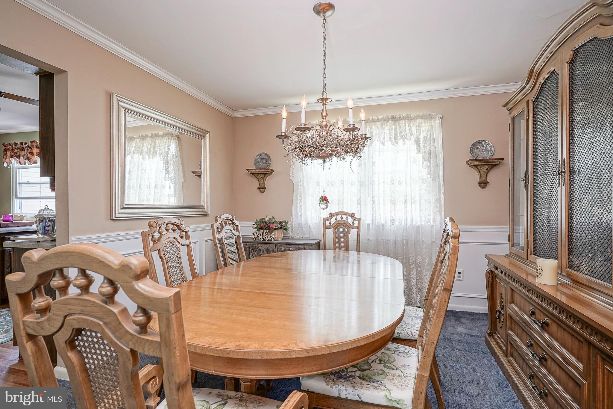 118 Golfview Drive Sewell, NJ 08080 - Photo 8 of 39 a dining room with furniture a chandelier and wooden floor
