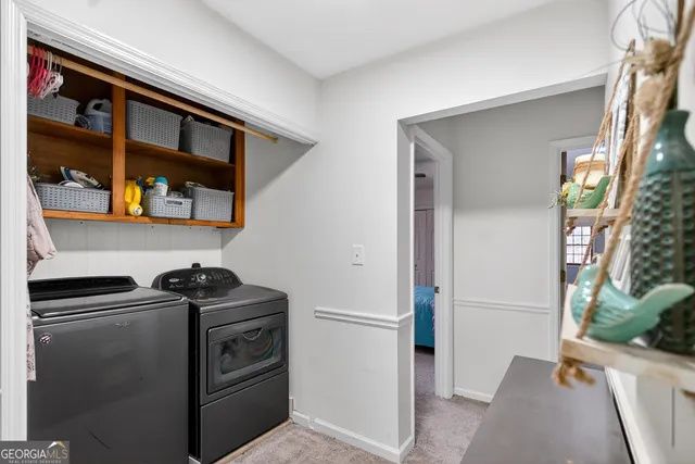 a bathroom with a sink a toilet and shower curtain