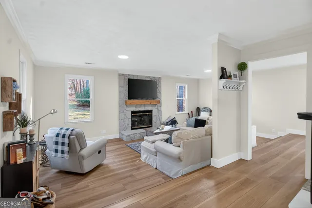 a kitchen with a table chairs and a refrigerator