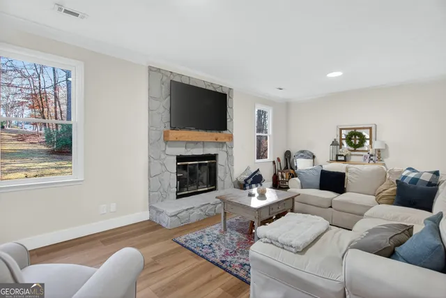 a kitchen with a sink a stove and cabinets