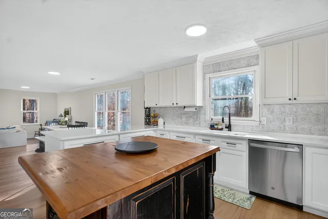 a room with furniture and a flat screen tv