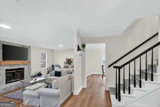 a kitchen with kitchen island stainless steel appliances a sink and refrigerator