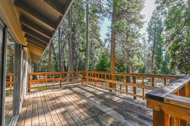 a view of a two chairs with the view of the balcony