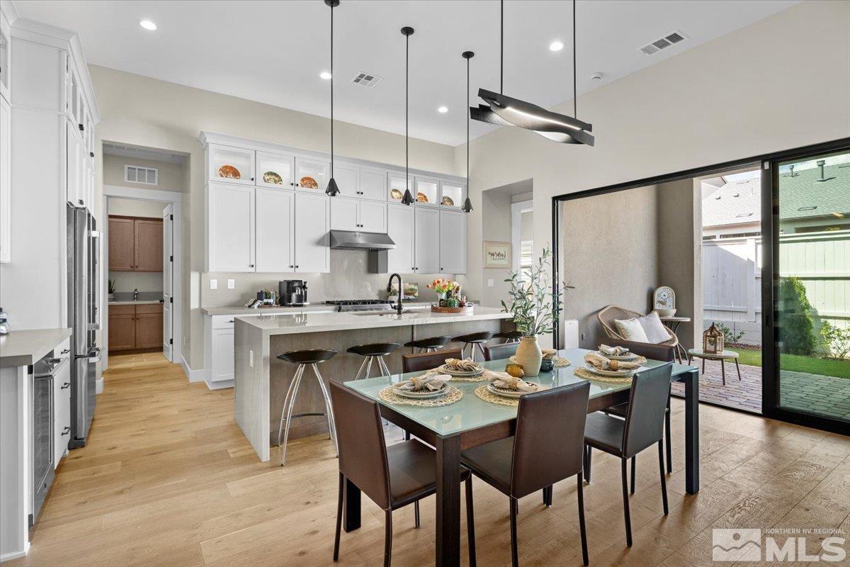 5566 Western Rider Trail Reno, NV 89511 - Photo 6 of 40 a kitchen with a table and chairs in it