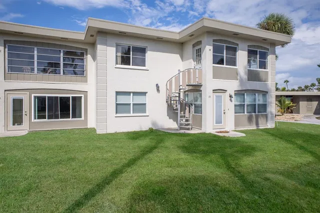 a view of house with yard