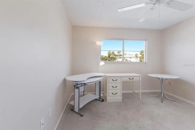 a spacious bedroom with a bed and a table