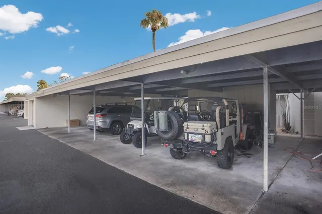 a view of a garage with parked cars