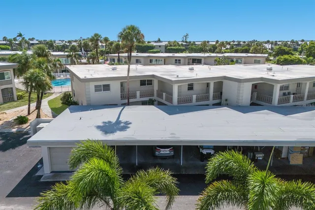 a view of house with outdoor space and swimming pool