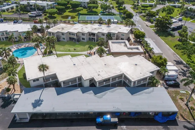 an aerial view of a house with a yard