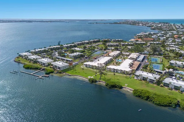 an aerial view of a house with a lake view