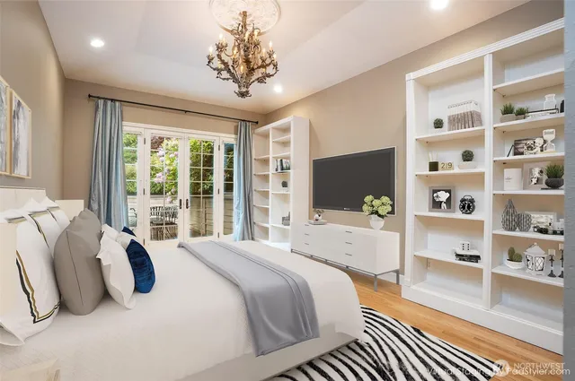 a bedroom with a large bed and a window