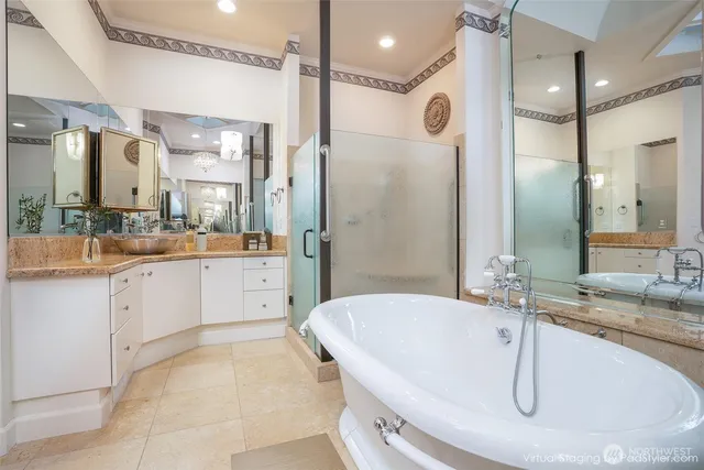 a large bathroom with a granite countertop sink mirror and shower