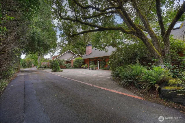 a table and chairs under an umbrella