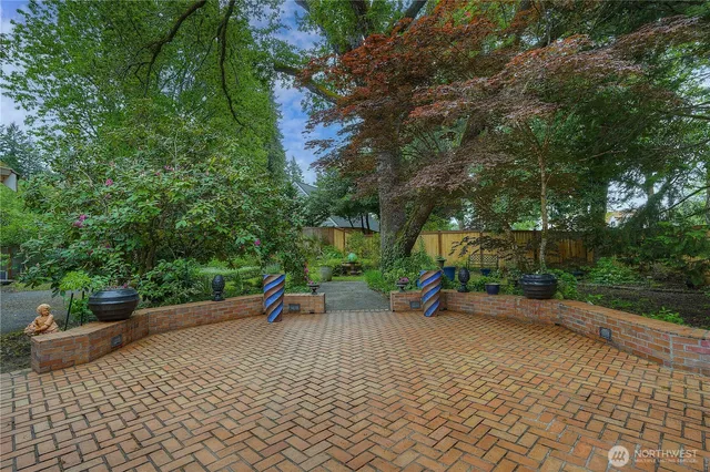 a view of a park with iron fence
