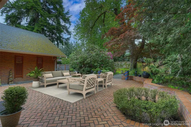 a backyard of a house with yard barbeque oven and outdoor seating