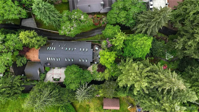 an sign that is sitting in front of flowers