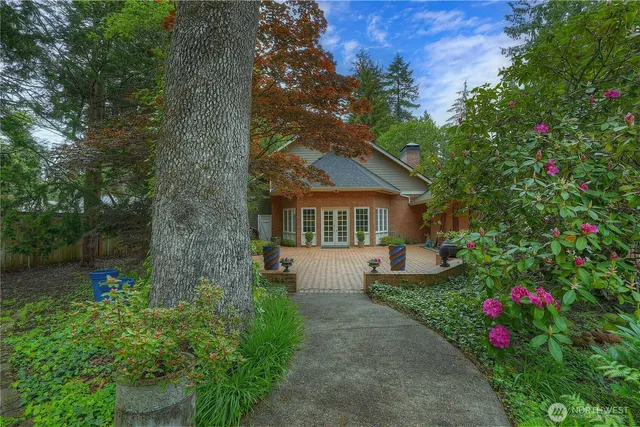 a front view of a house with garden