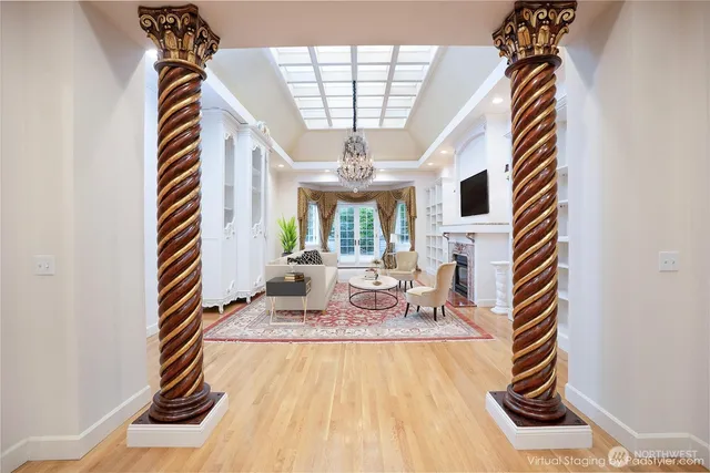 a view of hall way with furniture and staircase