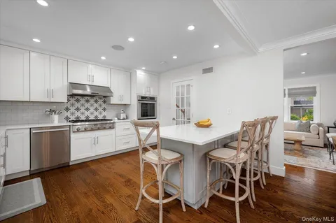 a kitchen with a table and chairs in it
