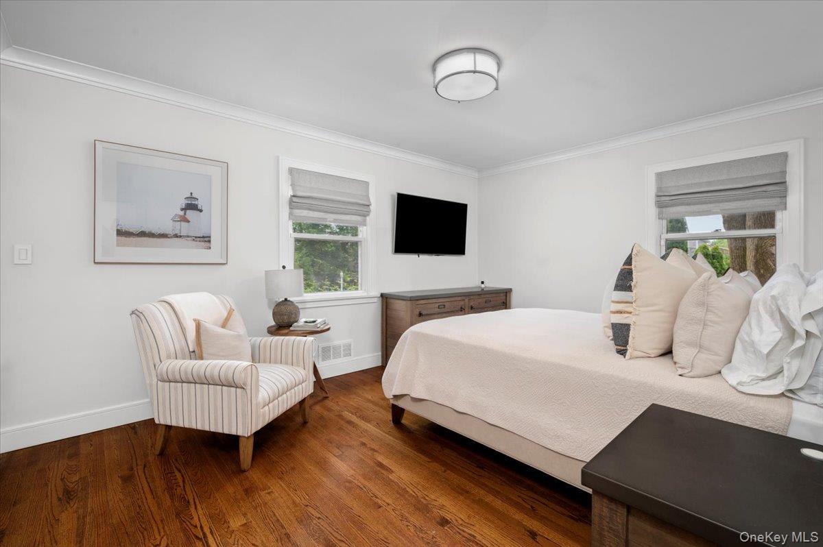 33 Temple Street Harrison, NY 10528 - Photo 18 of 31 a bedroom with a bed and a flat screen tv