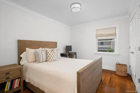 a bed room with a bed and a window