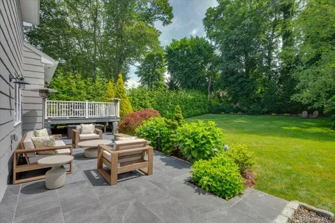 a car parked in the yard next to a road