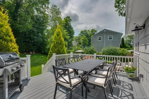 a view of a wooden chairs and table in patio