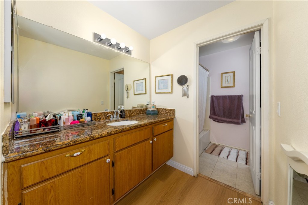 23220 Colony Park Drive Carson, CA 90745 - Photo 25 of 34 a bathroom with a sink vanity and a mirror