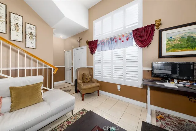 a bedroom with furniture and a window