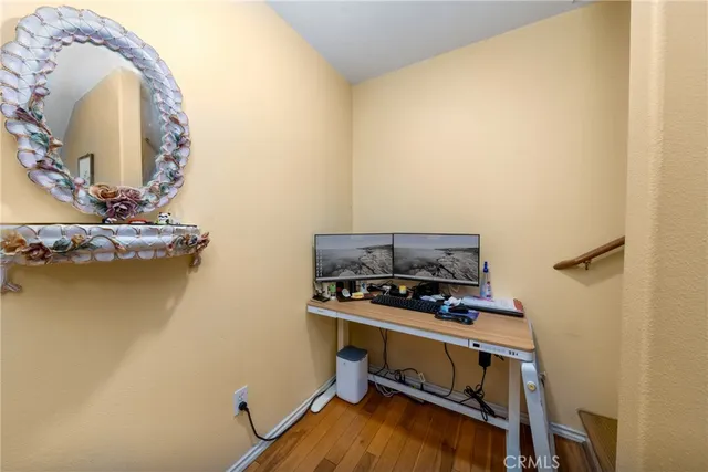 a room with a wooden floor and a table