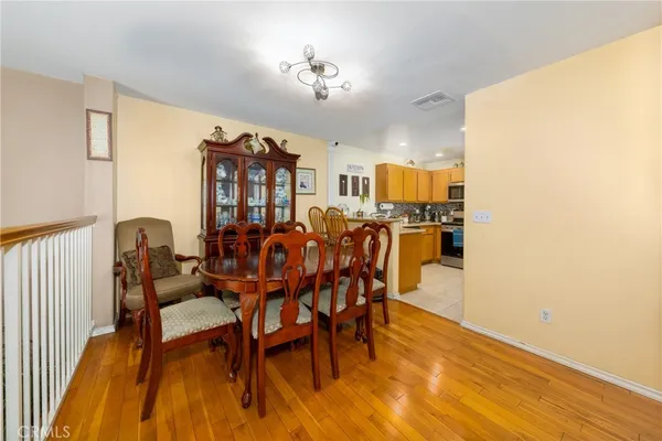 a view of a dining room with furniture and chandelier