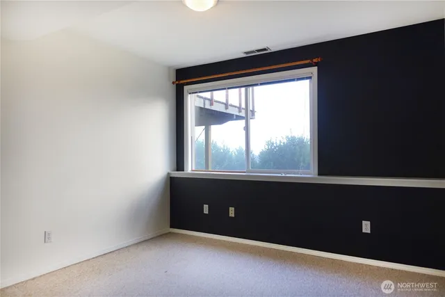 a view of a bathroom with bathtub and shower