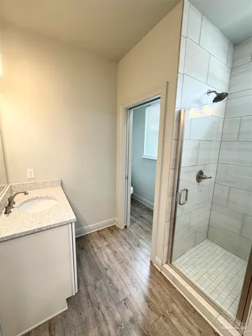 a bathroom with a sink and shower