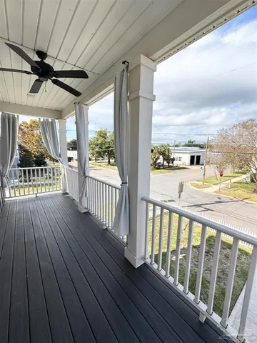 a view of a porch with wooden floor