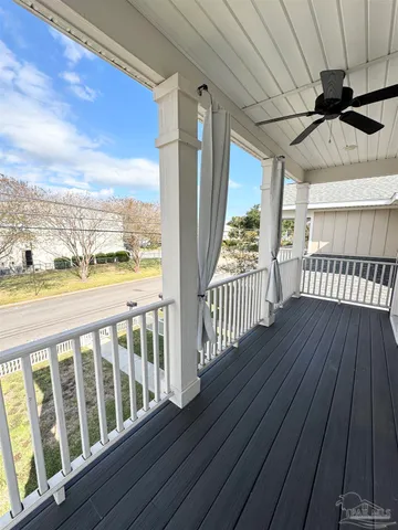 a view of a balcony with wooden floor