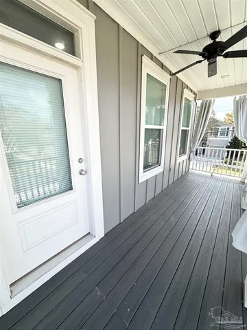 a view of an entryway with wooden floor