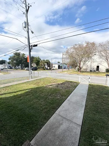 a front view of a house with a fence
