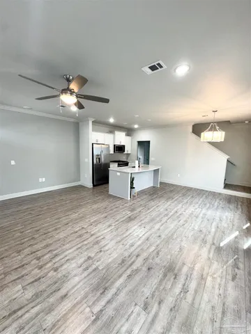 a view of a livingroom with a kitchen