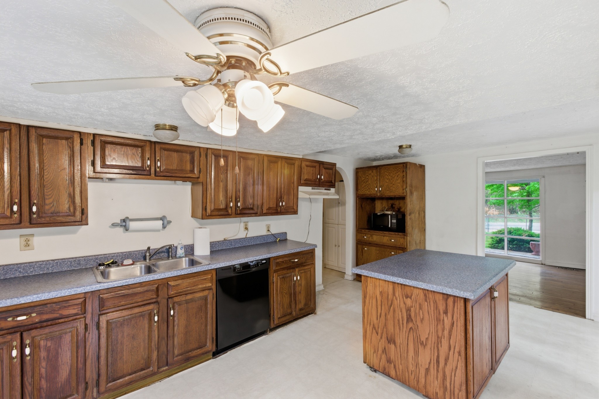 10075 Buckner Ridge Road Bon Aqua, TN 37025 - Photo 12 of 20 a kitchen with a sink a counter space cabinets and stainless steel appliances