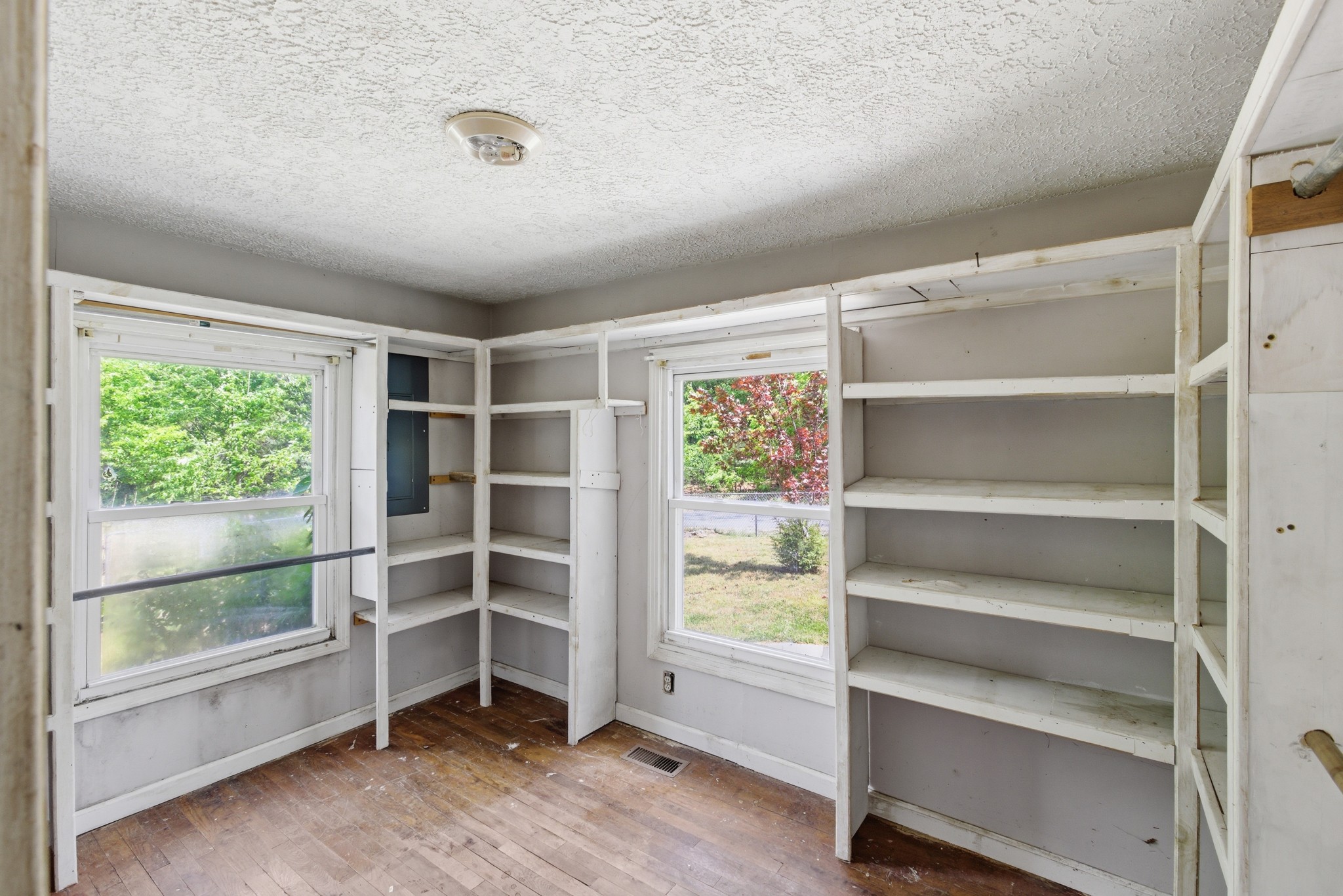 10075 Buckner Ridge Road Bon Aqua, TN 37025 - Photo 16 of 20 a view of walk in closet with empty racks