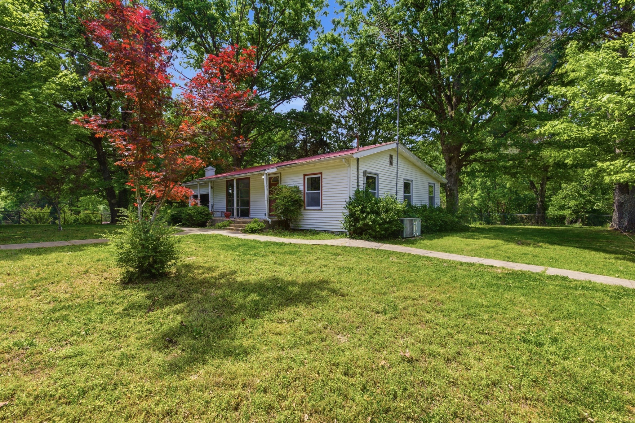 10075 Buckner Ridge Road Bon Aqua, TN 37025 - Photo 2 of 20 a house view with a garden space