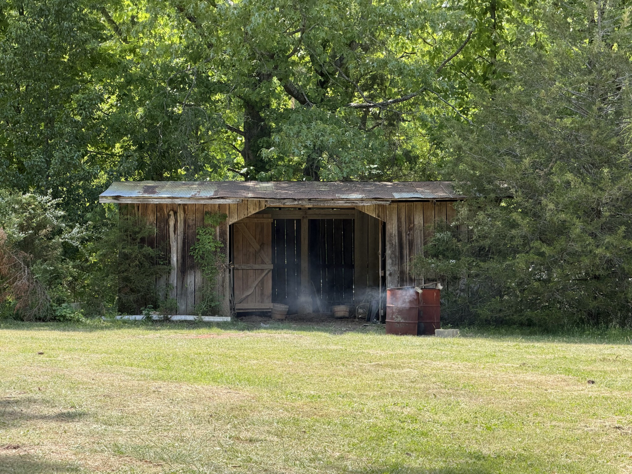 10075 Buckner Ridge Road Bon Aqua, TN 37025 - Photo 8 of 20 a front view of a house with a garden