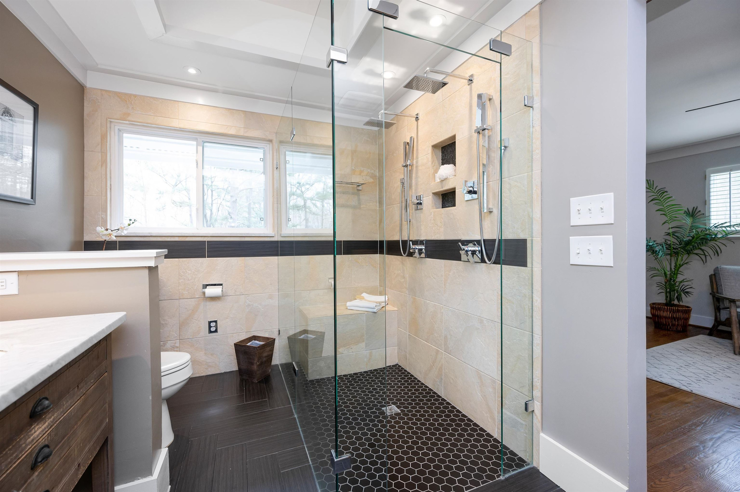 4907 Rembert Drive Raleigh, NC 27612 - Photo 23 of 52 Homeowner's retreat features a true sitting room, walk-in closet, and remodeled bath with dual vanities and swanky walk-in shower Homeowner's Retreat