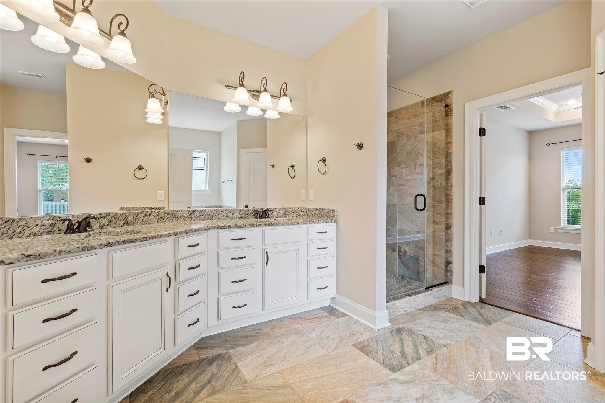 423 Breckin Drive Fairhope, AL 36532 - Photo 5 of 31 Bathroom with hardwood / wood-style floors, a shower with door, and vanity