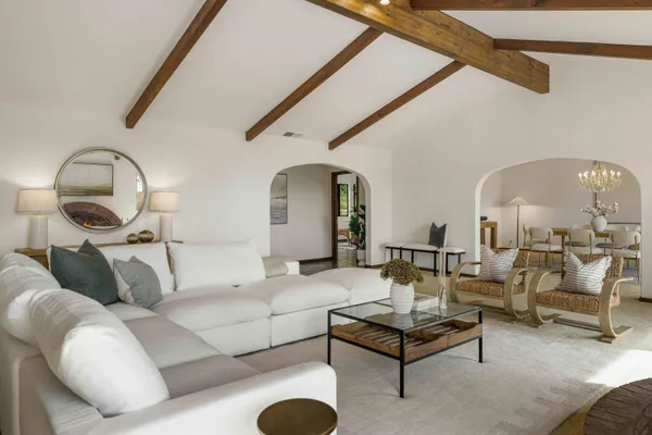 a spacious bedroom with a bed and large window