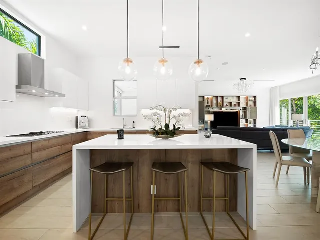a kitchen with a sink and stove
