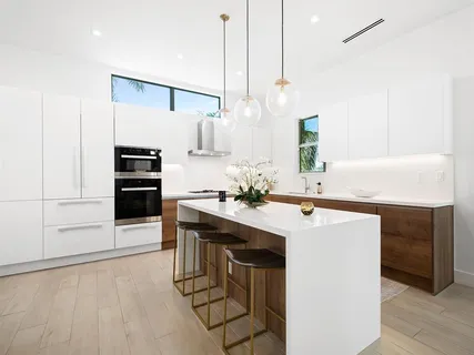 a kitchen with appliances and cabinets